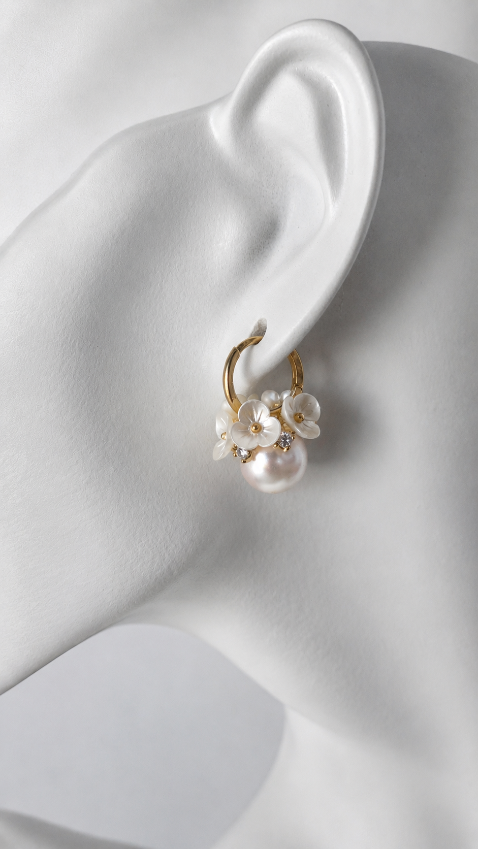 Delicate blossom detail on Aria Blossom & Pearl Hoops