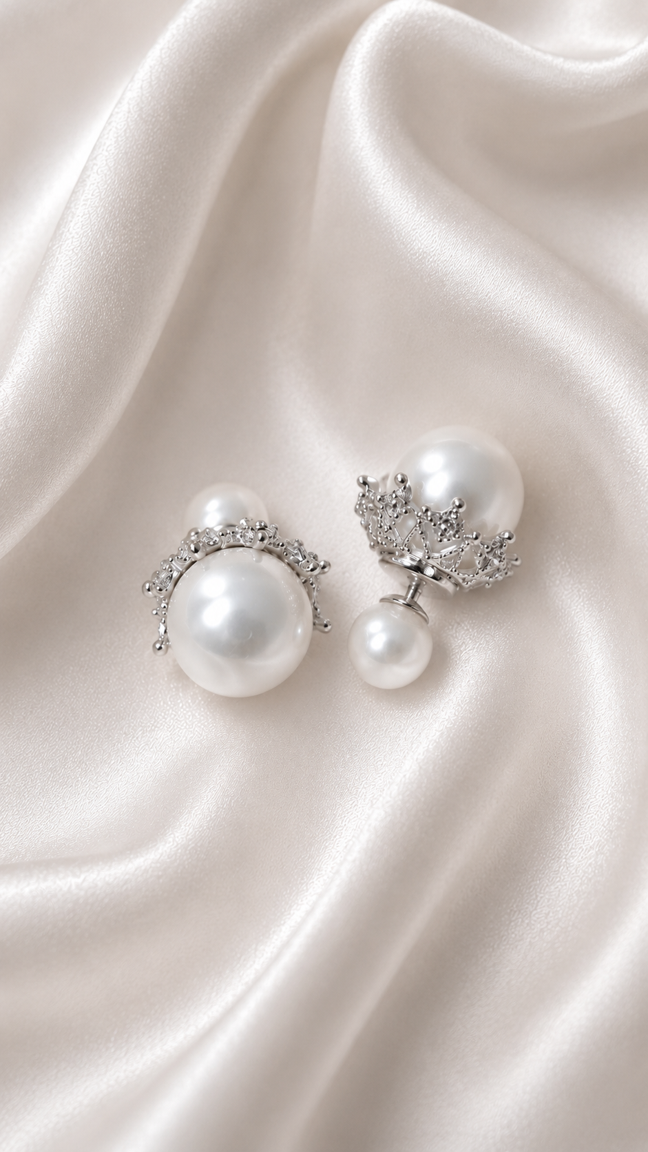 Aria Crown Pearl Studs styled on soft silk fabric