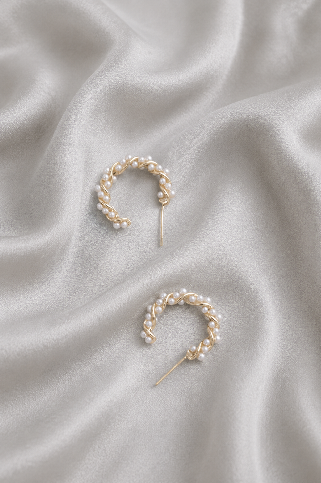 Close-up of pearl accents on Aria Pearl Vine Hoops