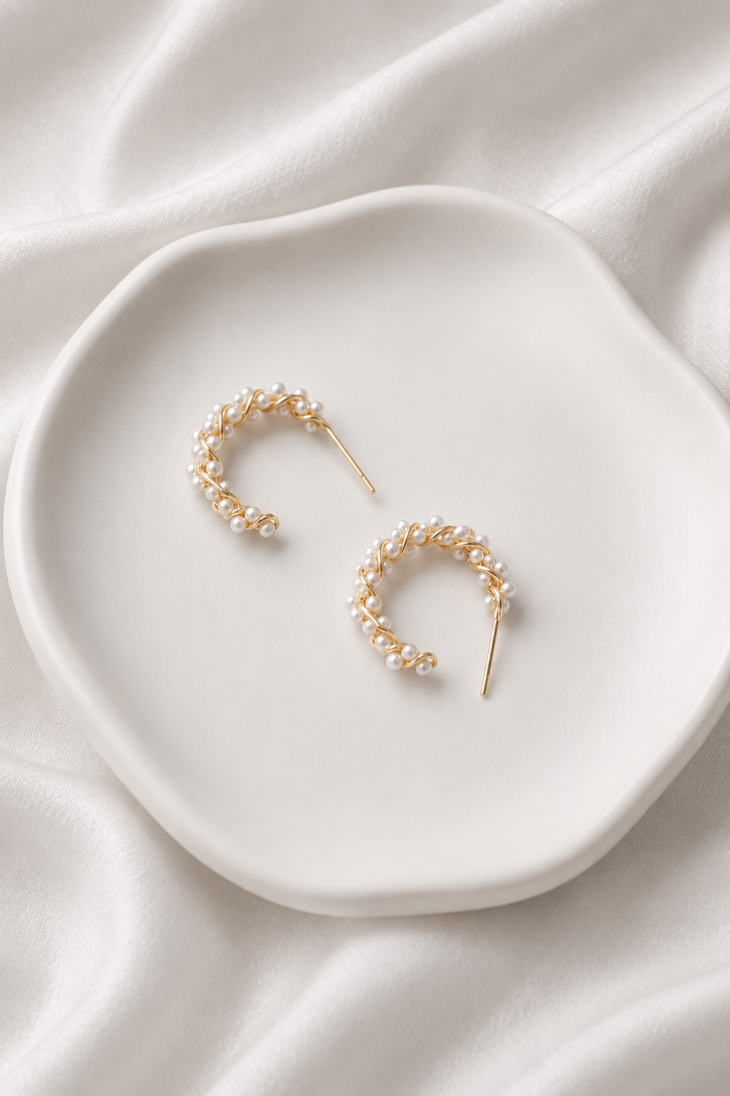 Delicate vine wrapping detail on Aria Pearl Vine Hoops
